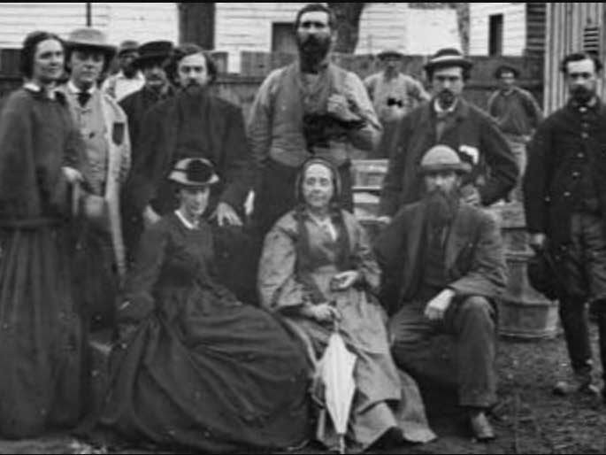 Historical photo in black and white depicting a seated group of individuals, from the Civil War era