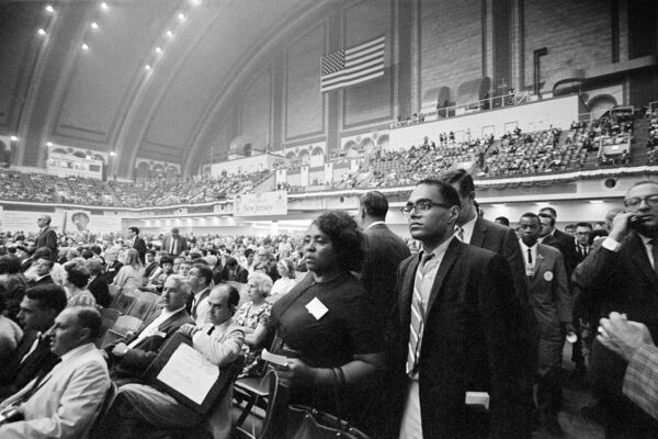 Fannie Lou Hamer, Bob Moses, and Aaron Henry walk into the Convention Hall at the 1964 Democratic National Convention in Atlantic City. Image Credit: George Ballis