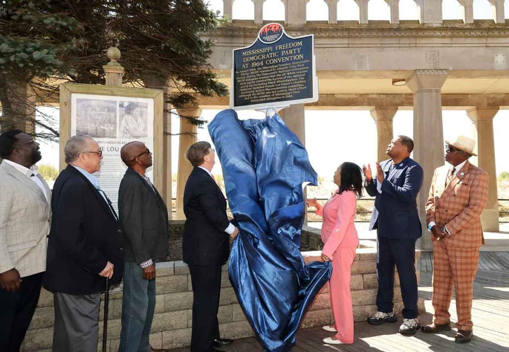 Dignitaries and civil rights veterans unveil a new historical marker on the Atlantic City Boardwalk.