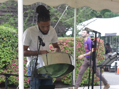 A steel drummer performs at Orange's "Music City" Festival