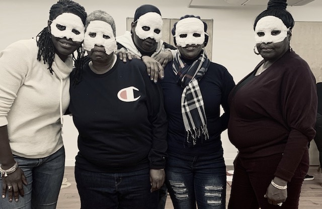 Five women in paper mache masks participating in Ritual4Return