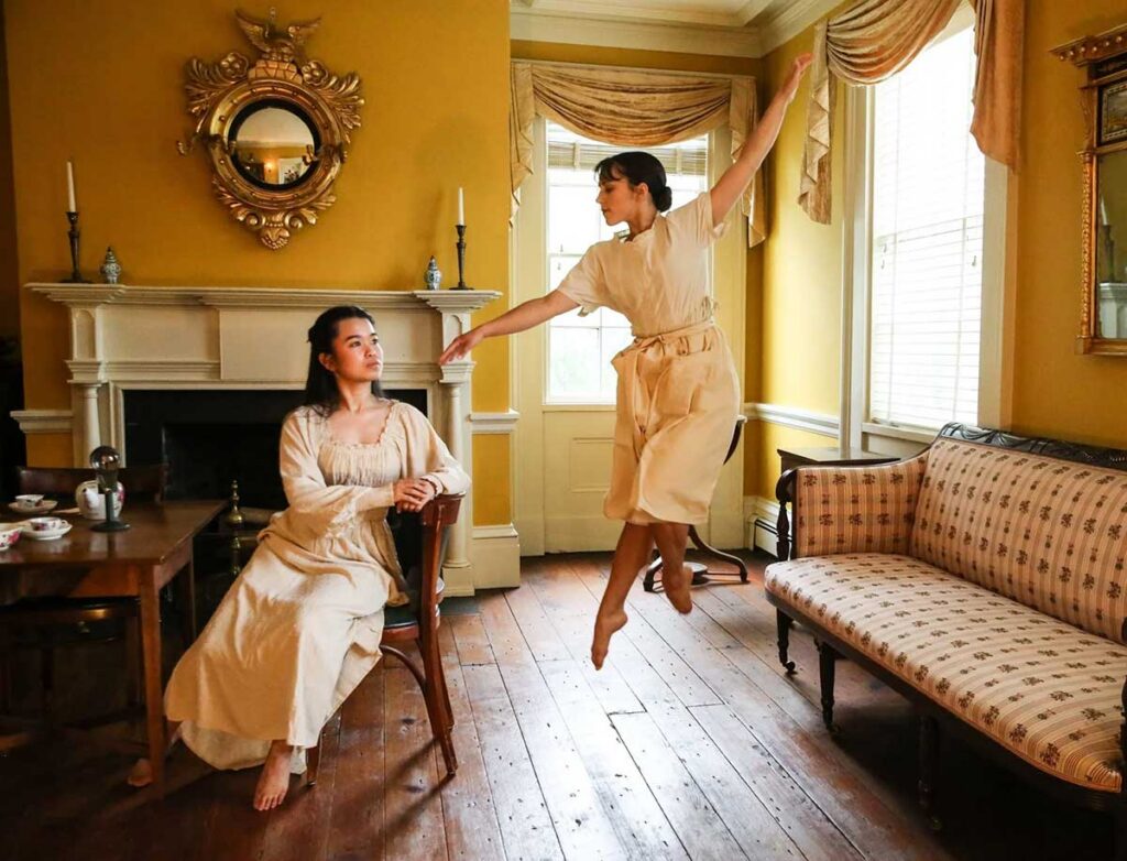 Two dancers performing in the parlor of the historic Crane House